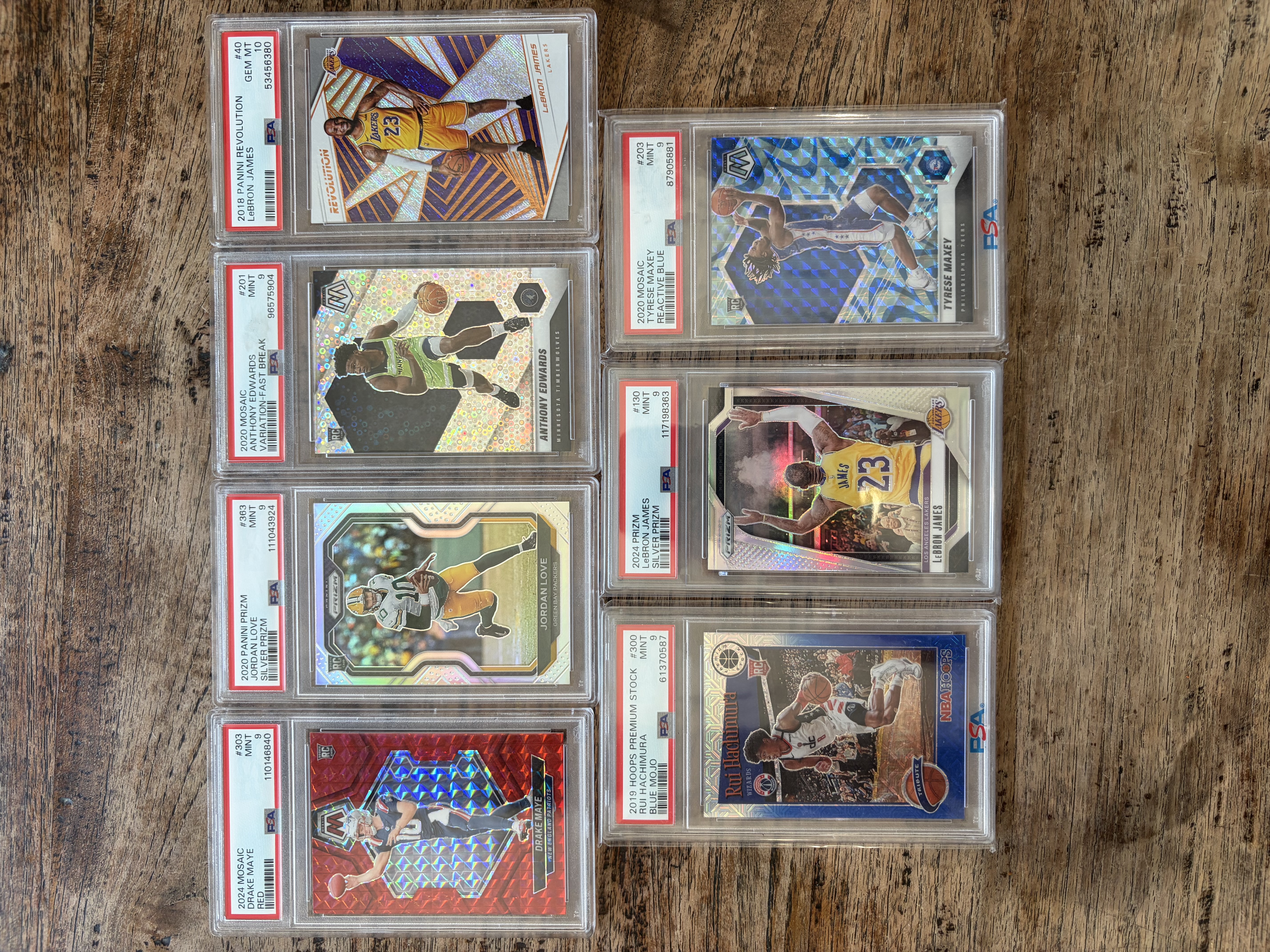 Stack of graded PSA slabs — fronts